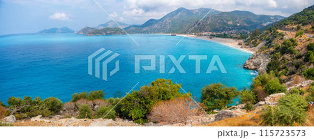 Aerial view of Oludeniz beach with people and boats in the morning, Coastline next to Fethiye, Turkey Aerial view of Oludeniz beach with people and boats in the morning, Coastline next to Fethiye, Turkey 115723573