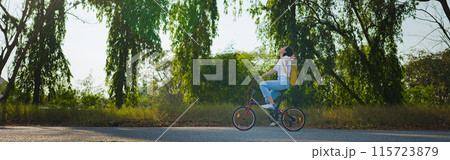 spring is comming concept with happy and cheerful feeling of asian woman riding bicycle spring is comming concept with happy and cheerful feeling of asian woman riding bicycle 115723879