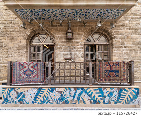 Old Town Baku Building With Ornate Balcony and hanged Rugs Old Town Baku Building With Ornate Balcony and hanged Rugs 115726427