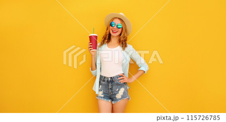 Summer joyful young woman with cup of coffee, stylish modern girl holds juice in tourist hat 115726785