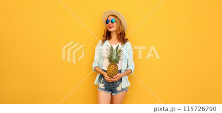 Summer vacation, happy joyful young woman with pineapple fruit, cheerful girl on yellow background 115726790