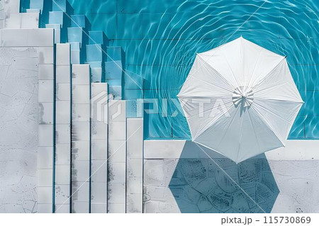 Aerial view of a swimming pool with a white umbrella by the side, depicting a summer vacation concept. Minimalistic Aerial view of a swimming pool with a white umbrella by the side, depicting a summer vacation concept. Minimalistic 115730869