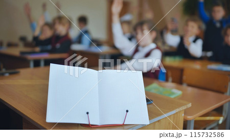 Notebook on a stand in the classroom during a lesson. Notebook on a stand in the classroom during a lesson. 115732586