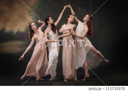 Poetic Movement. Group of dancers in flowing costumes evoke sense of timeless beauty. against vintage studio background. 115732878