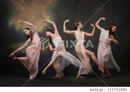 Ethereal Dance. Beautiful women in chiffon dresses perform poetic and expressive dance. against vintage studio background. Ethereal Dance. Beautiful women in chiffon dresses perform poetic and expressive dance. against vintage studio background. 115732896
