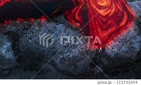 Molten Lava Flow on Solidified Lava Rocks 115732974