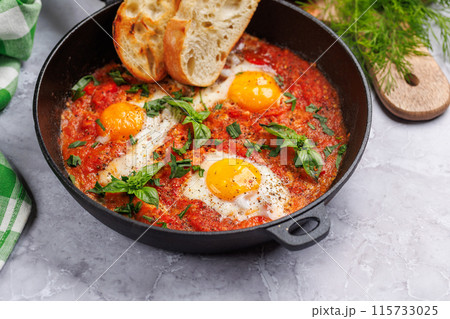 Delicious shakshuka breakfast in a pan Delicious shakshuka breakfast in a pan 115733025