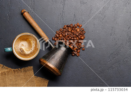 Roasted coffee beans and espresso coffee cup Roasted coffee beans and espresso coffee cup 115733034