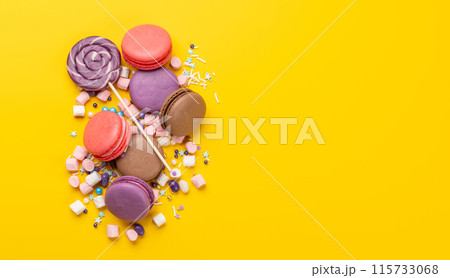 Various colorful candies, lollipops, and macaroons Various colorful candies, lollipops, and macaroons 115733068
