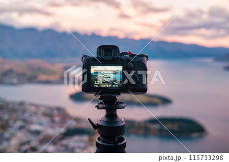 Set up a time lapse on camera at the viewpoint of Queenstown and Lake Wakatipu at New Zealand 115733298