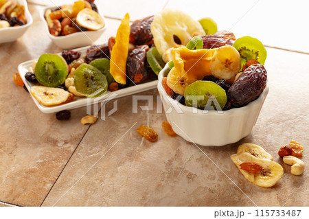 Dried tropical fruits with various nuts and raisins. 115733487