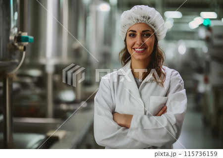 Confident Female Scientist in Food Production Facility Confident Female Scientist in Food Production Facility 115736159