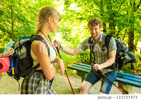 Hiking young couple with guitar backpack outdoor Hiking young couple with guitar backpack outdoor 115737473