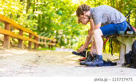 Hiker young couple with backpack in nature Hiker young couple with backpack in nature 115737475