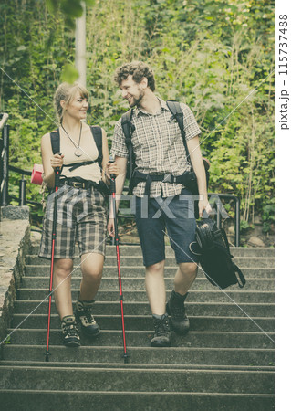 Two people tourists hiking walking on stairs. Two people tourists hiking walking on stairs. 115737488