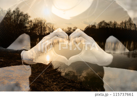 Girl shows heart with hands. 115737661