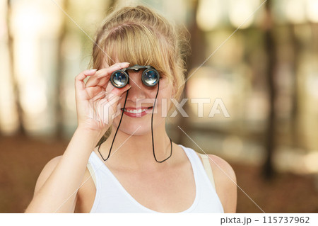 tourist woman looking through binoculars n city tourist woman looking through binoculars n city 115737962