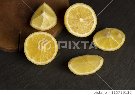 close-up of a table with slices of yellow lemon 115739136