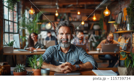 A business team, led by an experienced leader in a cozy office A business team, led by an experienced leader in a cozy office 115739734