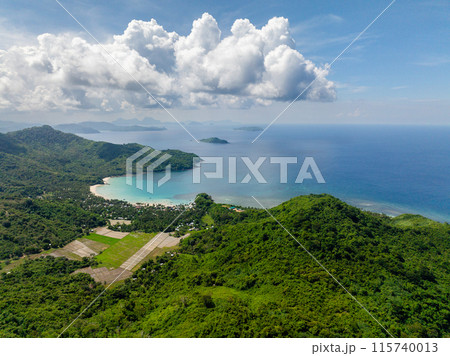Tropical Island with farmland and white sand beach. Diapela Beach. El Nido, Palawan, Philippines. 115740013