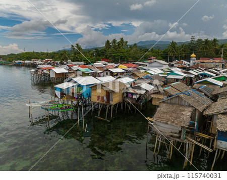 Top view of Stilt houses in the Zamboanga coastline. Clear turquoise water. Mindanao, Philippines. 115740031