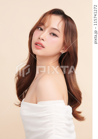 Beautiful young asian woman with clean fresh skin on beige background, Face care, Facial treatment, Cosmetology, beauty and spa, Asian women portrait. Beautiful young asian woman with clean fresh skin on beige background, Face care, Facial treatment, Cosmetology, beauty and spa, Asian women portrait. 115741272