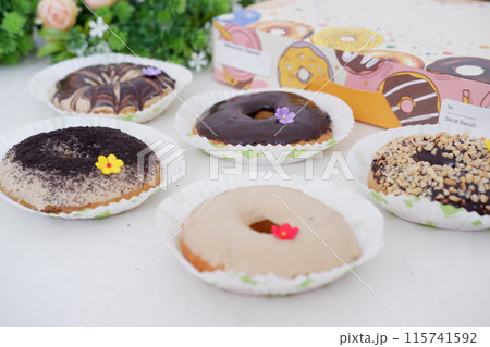 donuts with delicious topping as a background donuts with delicious topping as a background 115741592