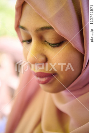 Close up Portrait of a Joyful Middle Eastern Hijabi Close up Portrait of a Joyful Middle Eastern Hijabi 115741675