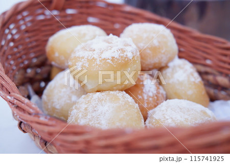delicious snowball donuts as a background delicious snowball donuts as a background 115741925