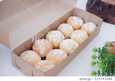 delicious snowball donuts as a background delicious snowball donuts as a background 115741946