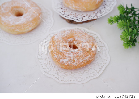 donuts with powdered sugar on top as a background 115742728