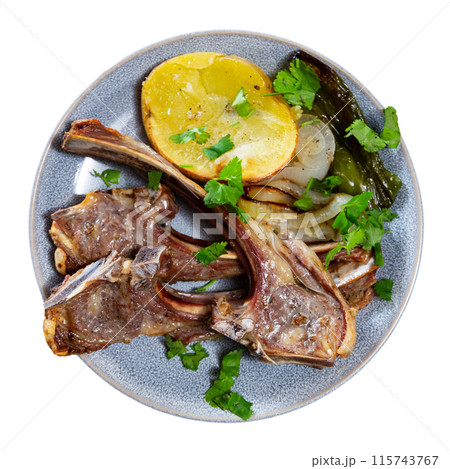 Lamb ribs served with potatoes and peppers Lamb ribs served with potatoes and peppers 115743767