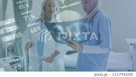 Image of infographic interface, diverse female doctors discussing patient reports in hospital 115744209