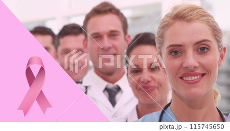 Image of pink breast cancer ribbon over group of smiling doctors Image of pink breast cancer ribbon over group of smiling doctors 115745650