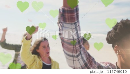 Image of green hearts over diverse people rising fists Image of green hearts over diverse people rising fists 115746010
