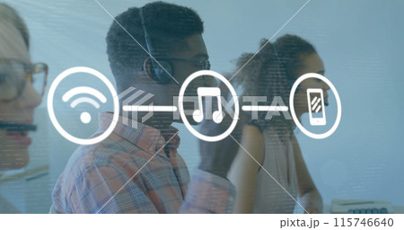 Image of media icons over diverse business people using phone headsets in office Image of media icons over diverse business people using phone headsets in office 115746640