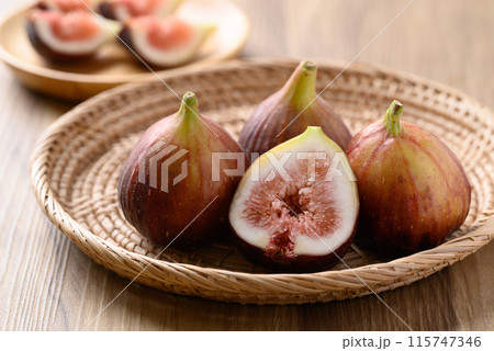 Fresh fig in natural basket on wooden background, Healthy fruit Fresh fig in natural basket on wooden background, Healthy fruit 115747346
