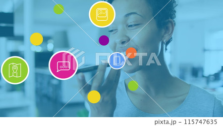 Image of network of connections and icons over businesswoman wearing phone headset Image of network of connections and icons over businesswoman wearing phone headset 115747635
