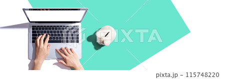 Laptop computer with piggy bank 115748220