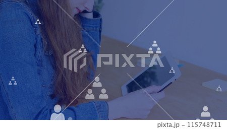 Image of network of connections with icons over caucasian woman using tablet Image of network of connections with icons over caucasian woman using tablet 115748711