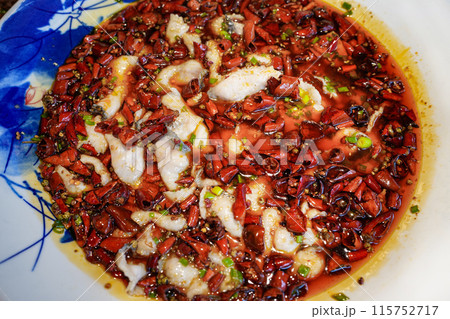 Poached sliced sea bass with vegetables and spicy seasoning, Chinese food Poached sliced sea bass with vegetables and spicy seasoning, Chinese food 115752717