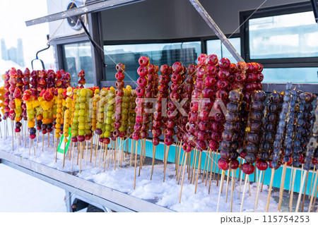 Tang hulu or Chinese sugar-coated fruit stick. The snack of China in the Winter Tang hulu or Chinese sugar-coated fruit stick. The snack of China in the Winter 115754253