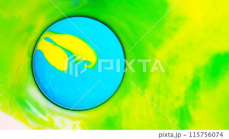 Top view of macro abstract photography of the drop of acrylic on gradient yellow to green background 115756074
