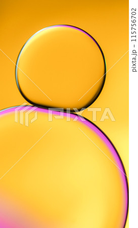 Top view of macro abstract photography of oil droplet on golden yellow gradient background for use as background, illustration or copy space Top view of macro abstract photography of oil droplet on golden yellow gradient background for use as background, illustration or copy space 115756702