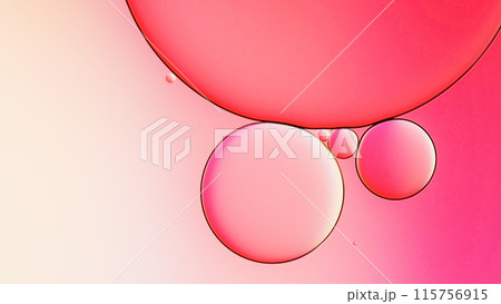 macrophotography of oil and water on gradient pink to white abstract background macrophotography of oil and water on gradient pink to white abstract background 115756915