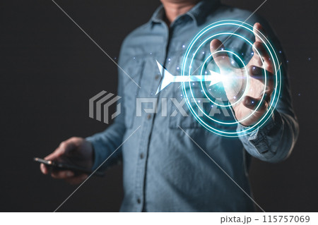 businessman holding target icon of success, leaders and business success, achieving goals objective target strategy planning and concept. 115757069