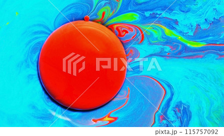 Top view of macro abstract background of the red acrylic droplet on blue 115757092
