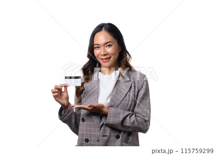 Young beautiful businesswoman presenting credit card in hand standing against white background 115759299