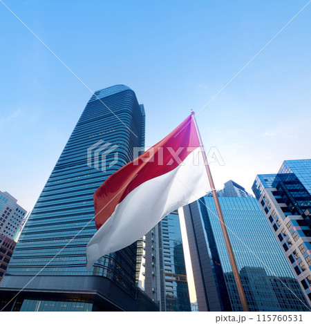 Indonesian flag waving in modern city center Indonesian flag waving in modern city center 115760531