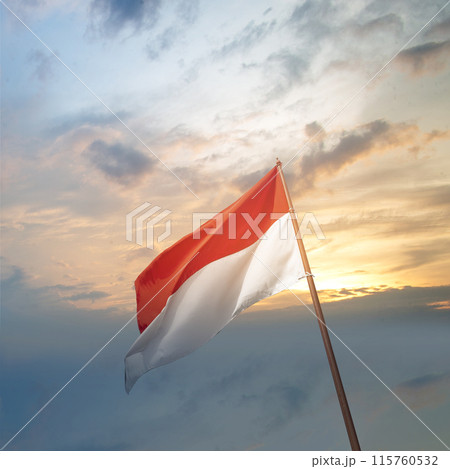 Indonesian flag waving in the wind at sunset Indonesian flag waving in the wind at sunset 115760532
